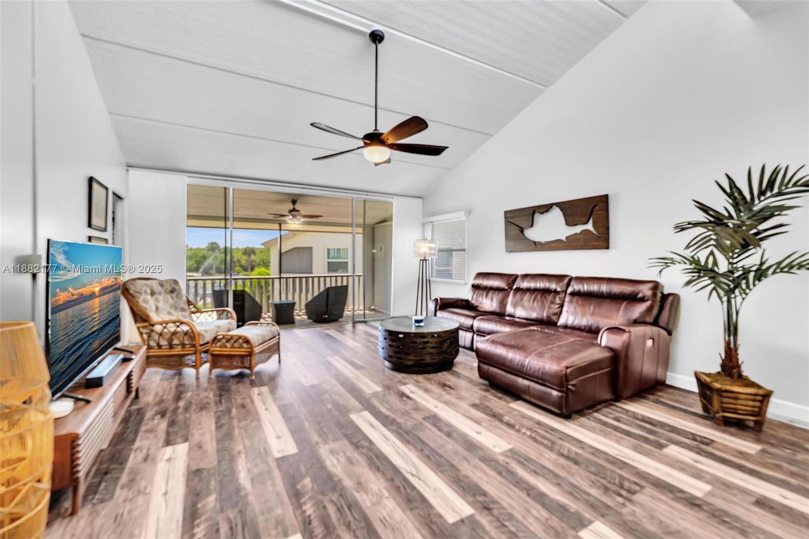1456 Northeast Ocean Boulevard, Unit 7204 Stuart, FL 34996 - Photo 30 of 64 a living room with furniture large window and a table