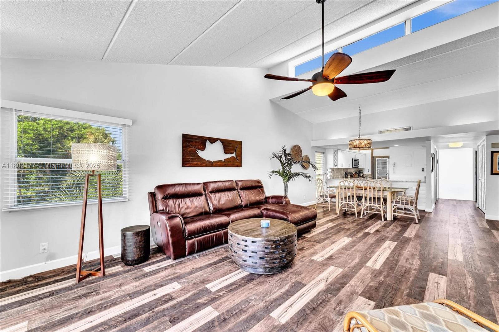 1456 Northeast Ocean Boulevard, Unit 7204 Stuart, FL 34996 - Photo 33 of 64 a living room with furniture a ceiling fan and a window