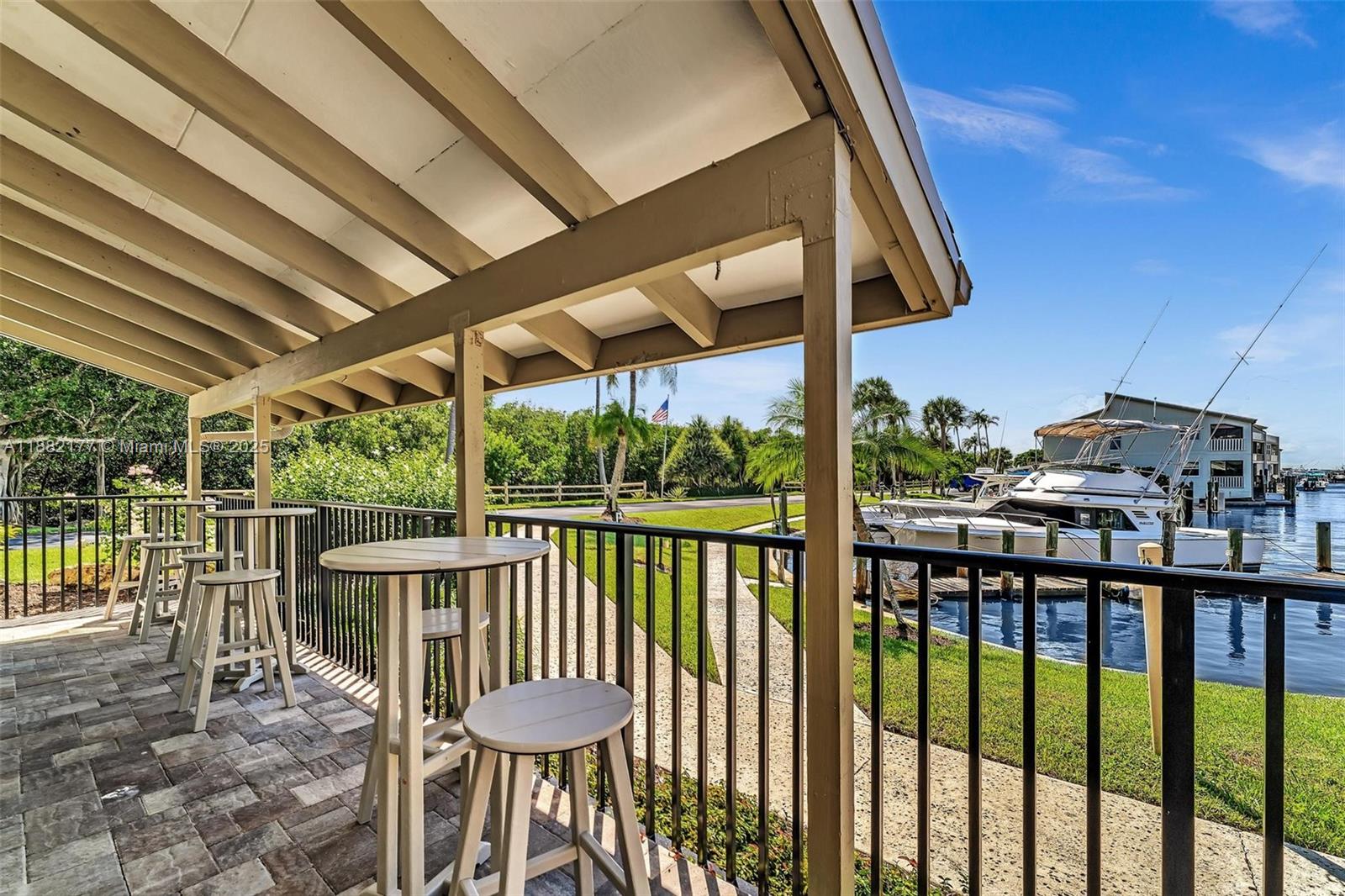1456 Northeast Ocean Boulevard, Unit 7204 Stuart, FL 34996 - Photo 44 of 64 a view of a chairs and table in the balcony