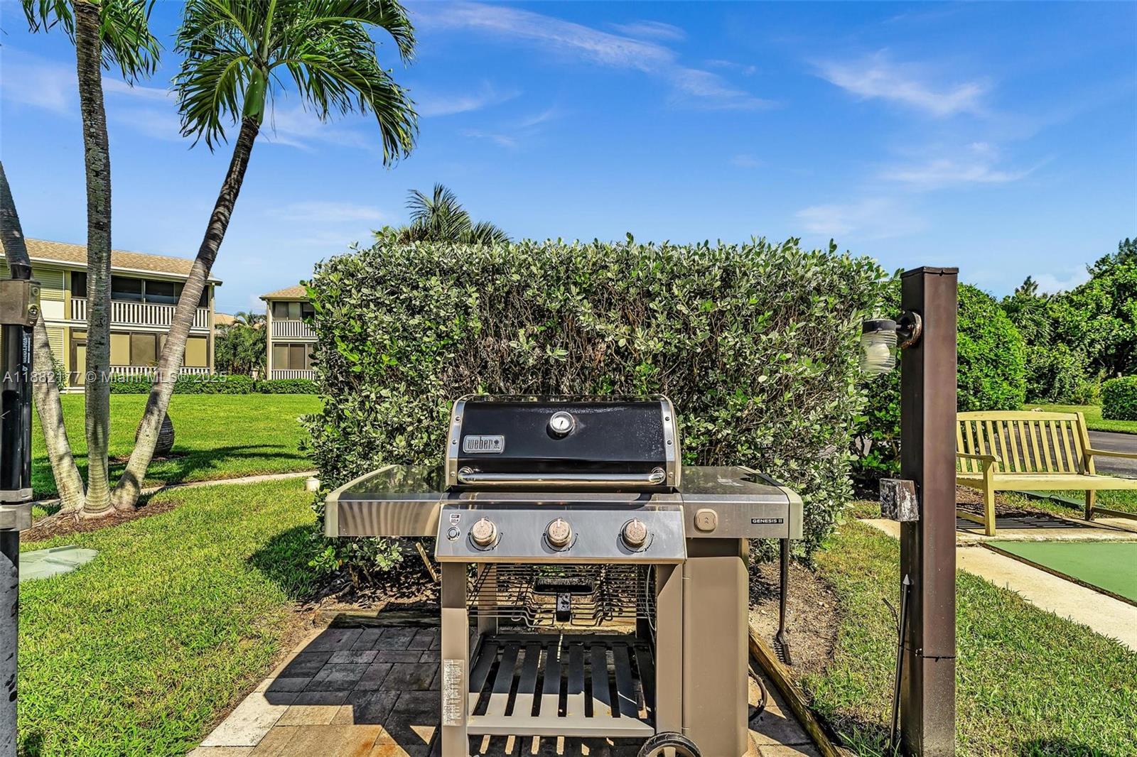 1456 Northeast Ocean Boulevard, Unit 7204 Stuart, FL 34996 - Photo 46 of 64 a view of a chairs and table on the garden
