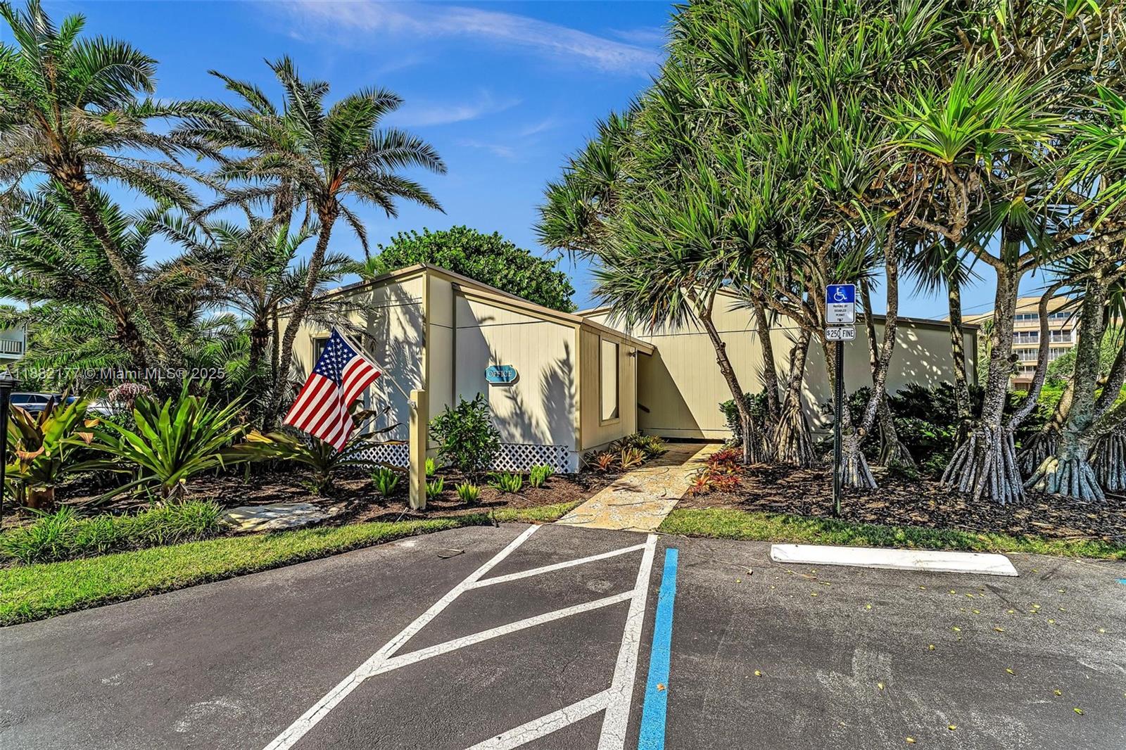1456 Northeast Ocean Boulevard, Unit 7204 Stuart, FL 34996 - Photo 48 of 64 a view of a street with palm trees