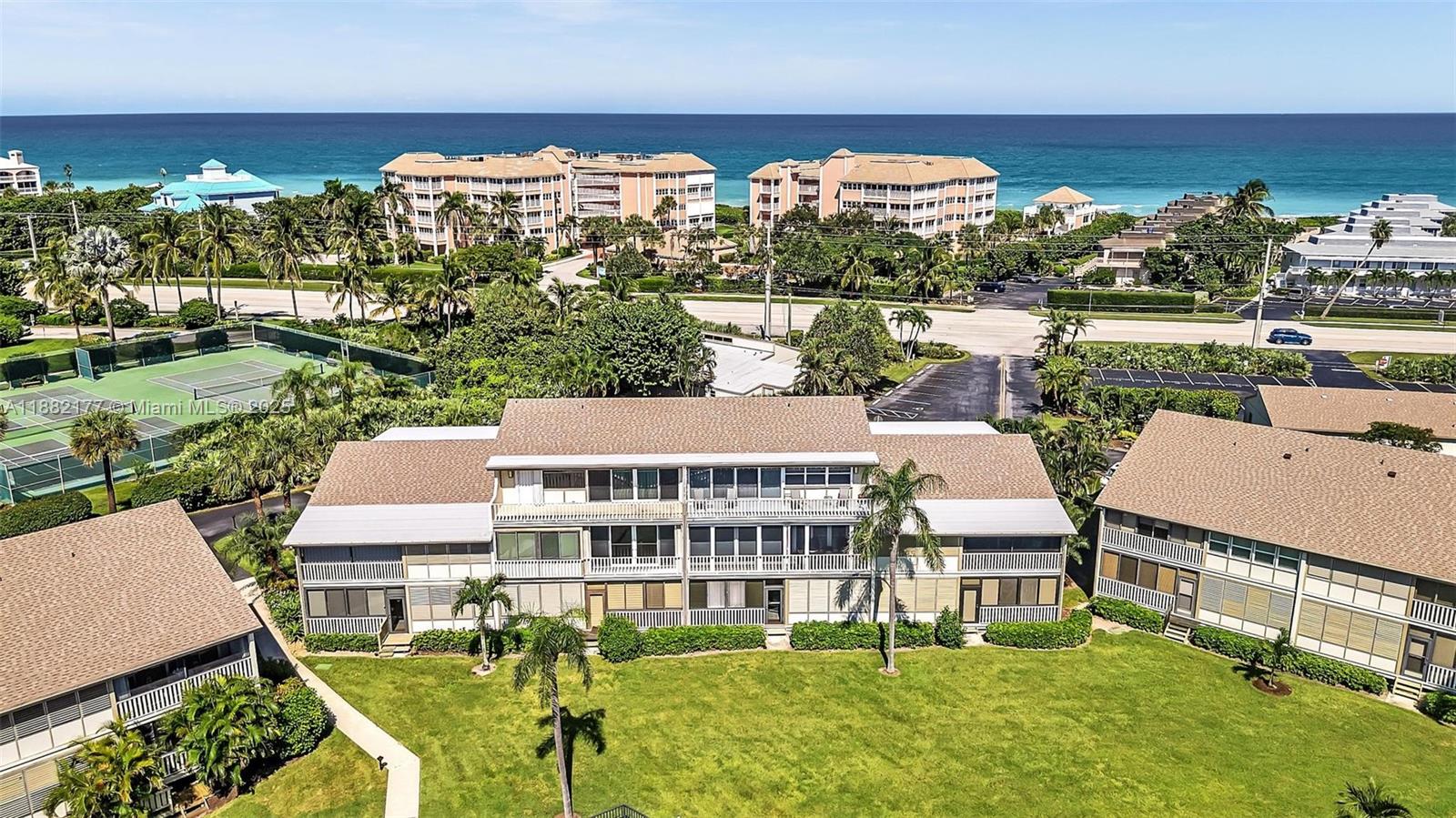 1456 Northeast Ocean Boulevard, Unit 7204 Stuart, FL 34996 - Photo 62 of 64 an aerial view of a house with swimming pool garden and lake view