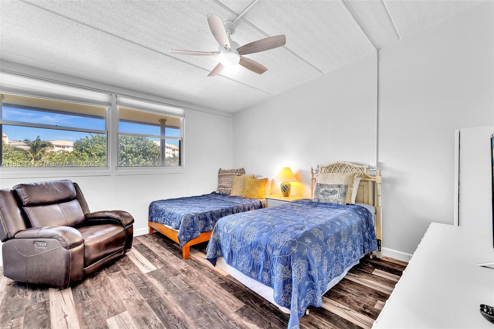 1456 Northeast Ocean Boulevard, Unit 7204 Stuart, FL 34996 - Photo 7 of 64 a bedroom with two beds and a large window