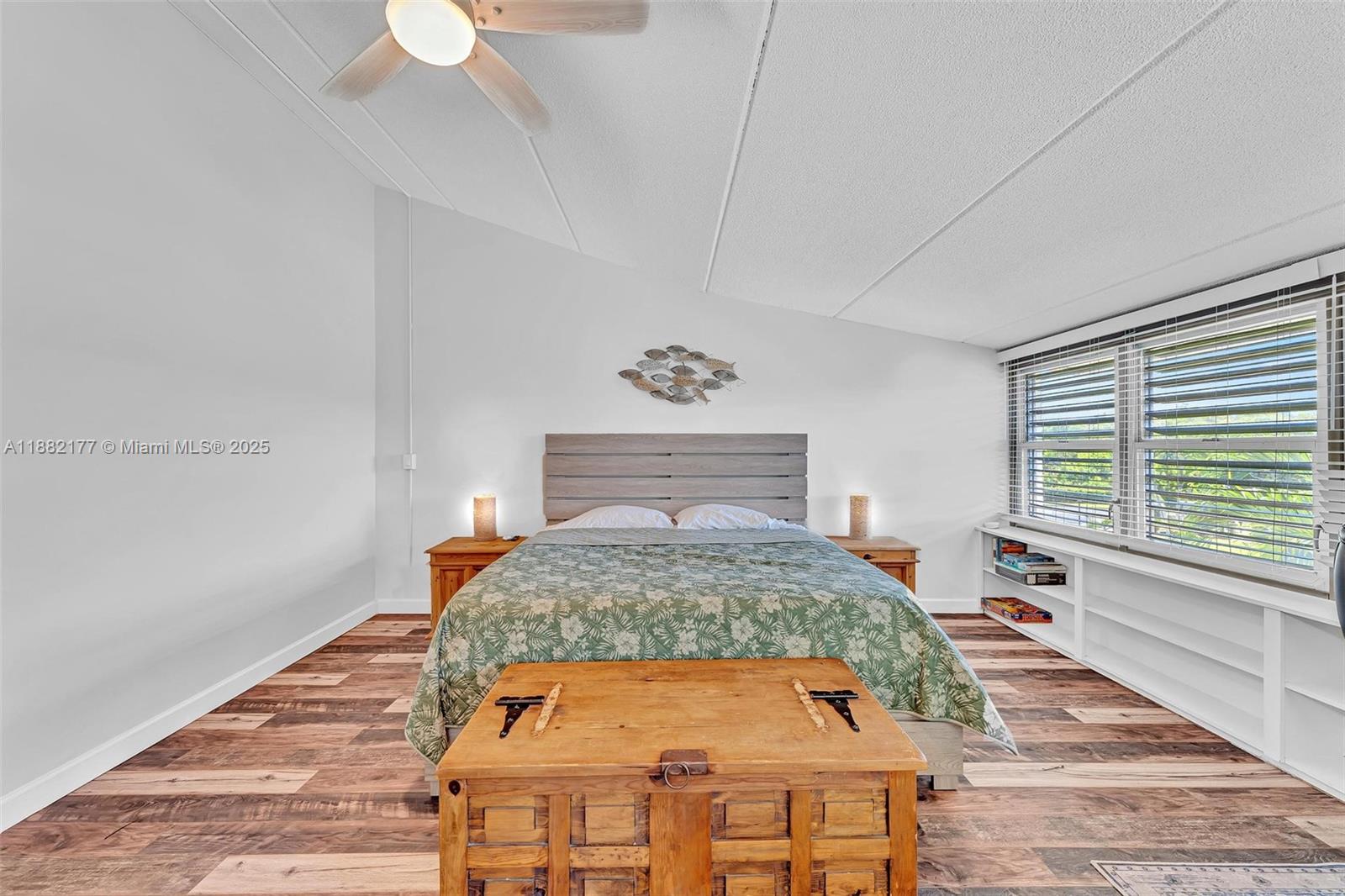 1456 Northeast Ocean Boulevard, Unit 7204 Stuart, FL 34996 - Photo 10 of 64 a bed sitting in a bedroom next to a window