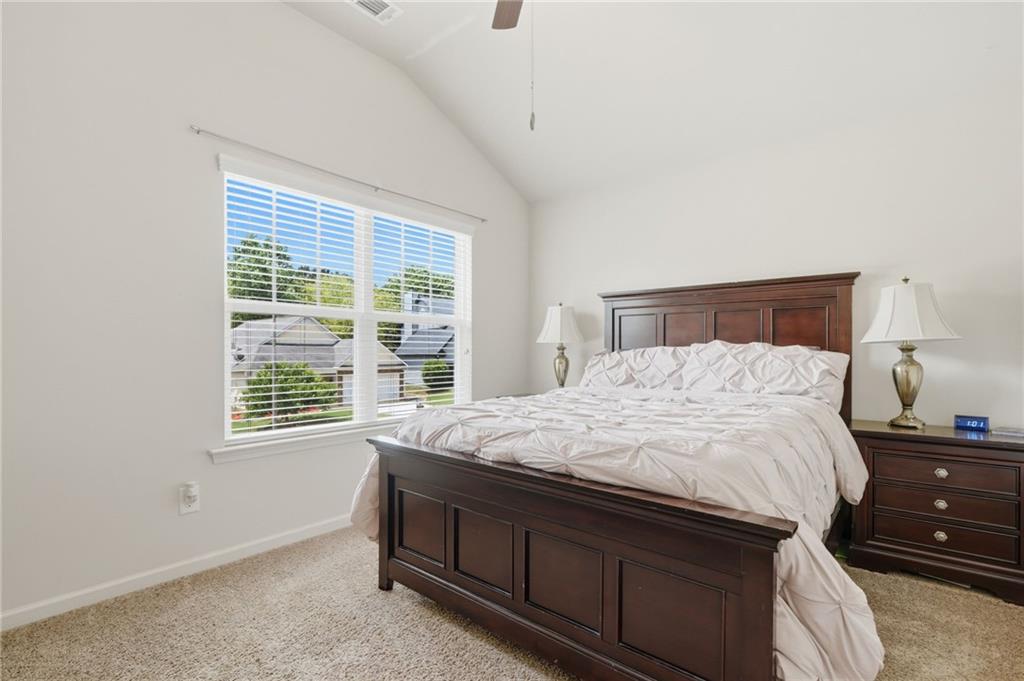 123 Renford Road Ball Ground, GA 30107 - Photo 18 of 27 a bedroom with a bed and a window