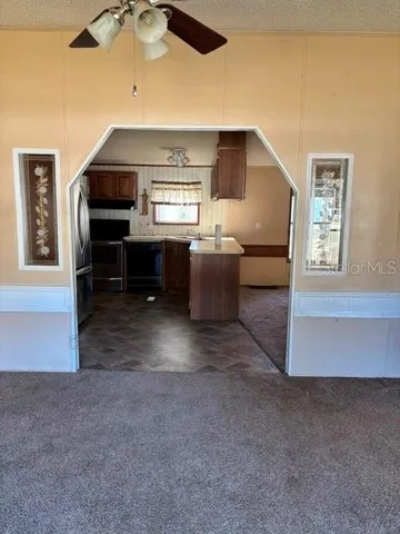 a view of livingroom with furniture and window