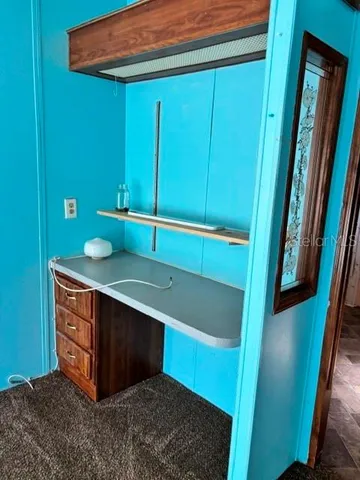 a bathroom with a sink and vanity