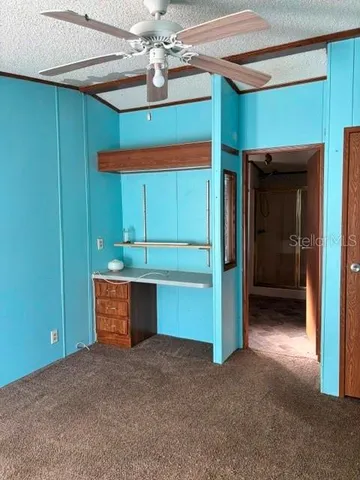 a room with closet and a ceiling fan