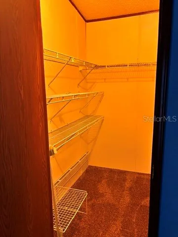 a view of a room with racks on the wall