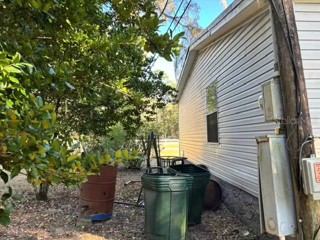 a backyard of a house with stainless steel appliances
