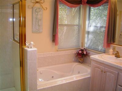 5236 Beaumont Way Santa Rosa, CA 95409 - Photo 2 of 10 a bath room with a bath tub and a sink