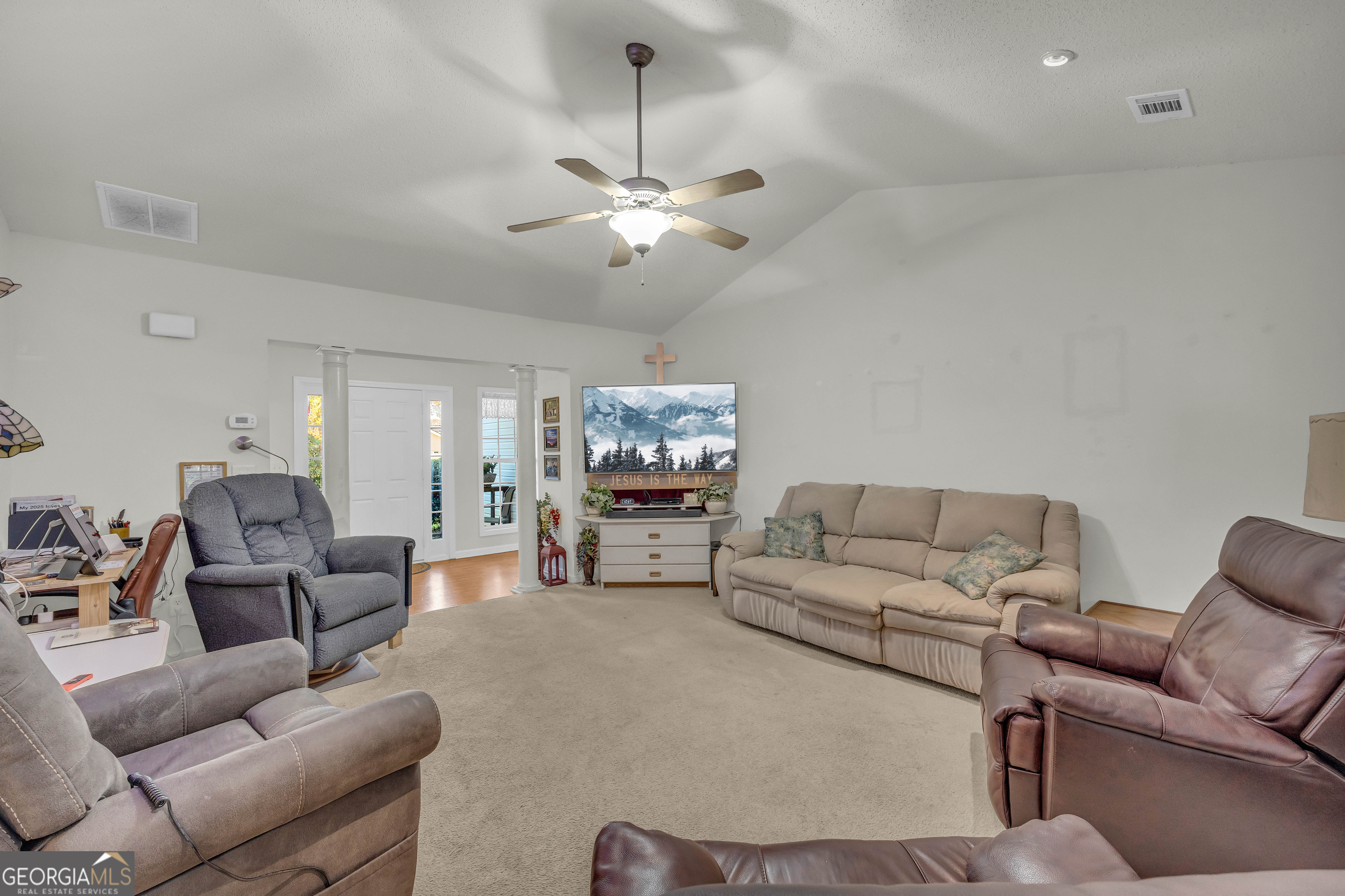 357 Sundew Lane Mount Airy, GA 30563 - Photo 11 of 53 a living room with furniture and a couch