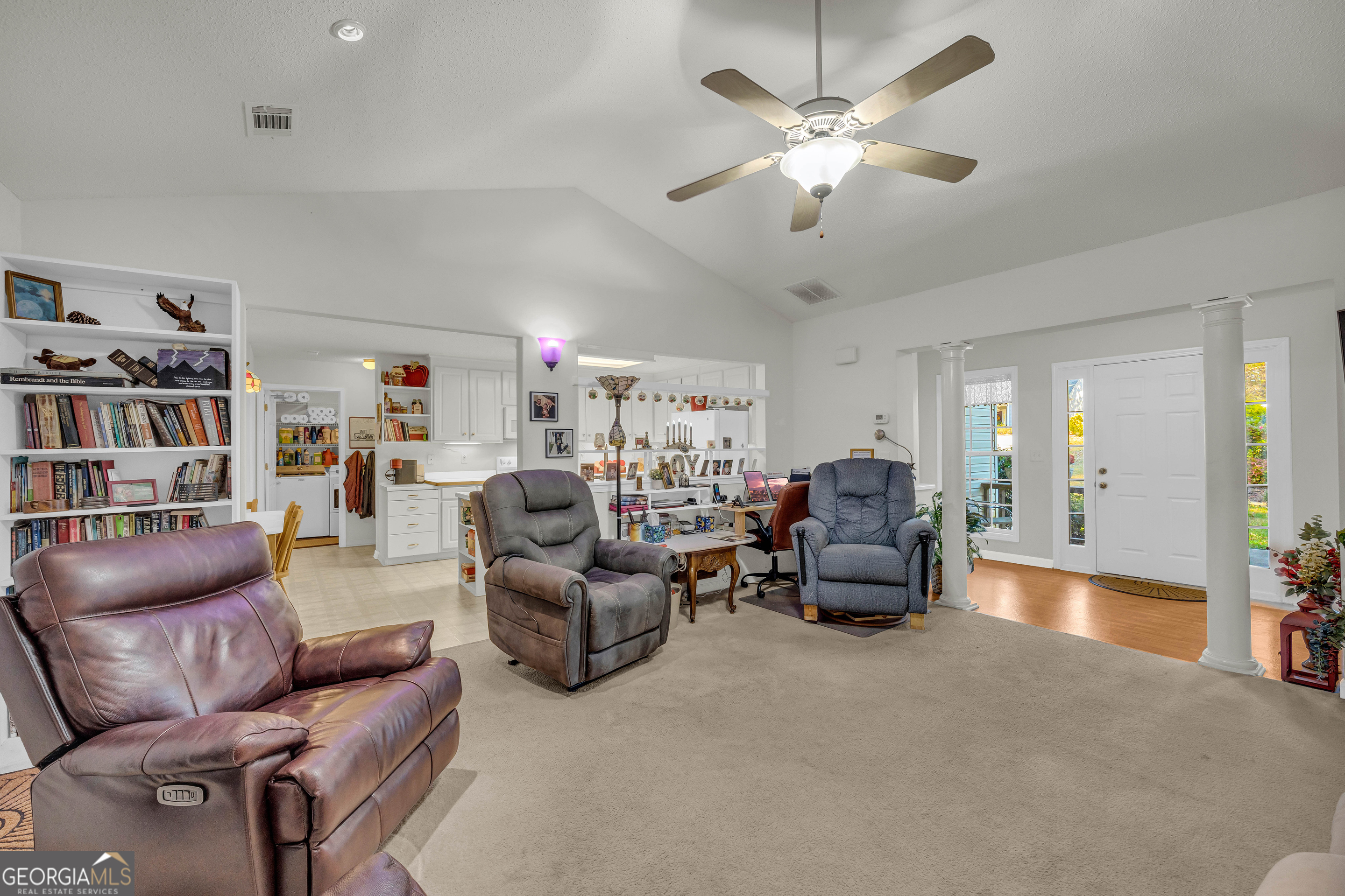 357 Sundew Lane Mount Airy, GA 30563 - Photo 12 of 53 a living room with furniture and a chandelier
