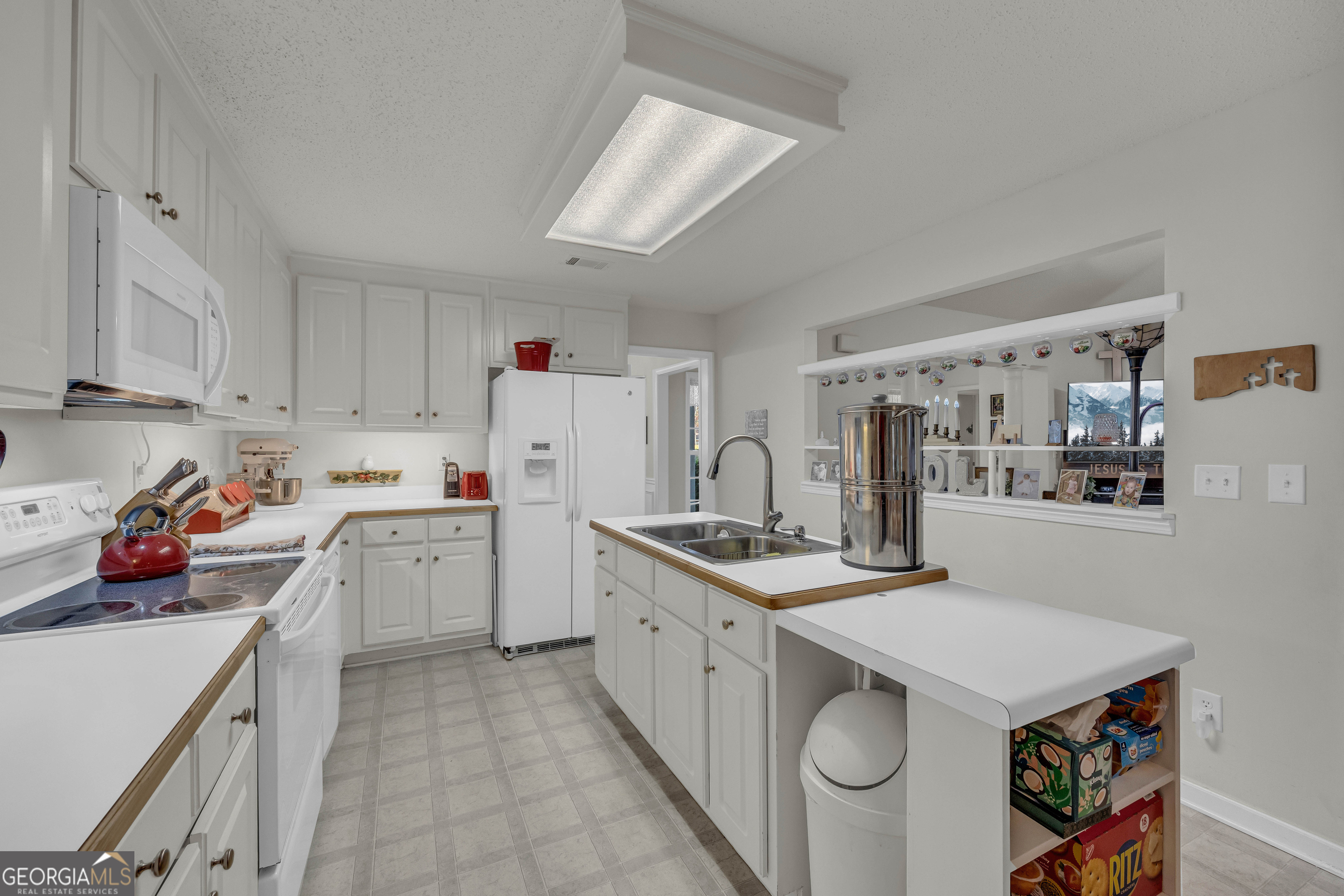 357 Sundew Lane Mount Airy, GA 30563 - Photo 18 of 53 a utility room with cabinets washer and dryer