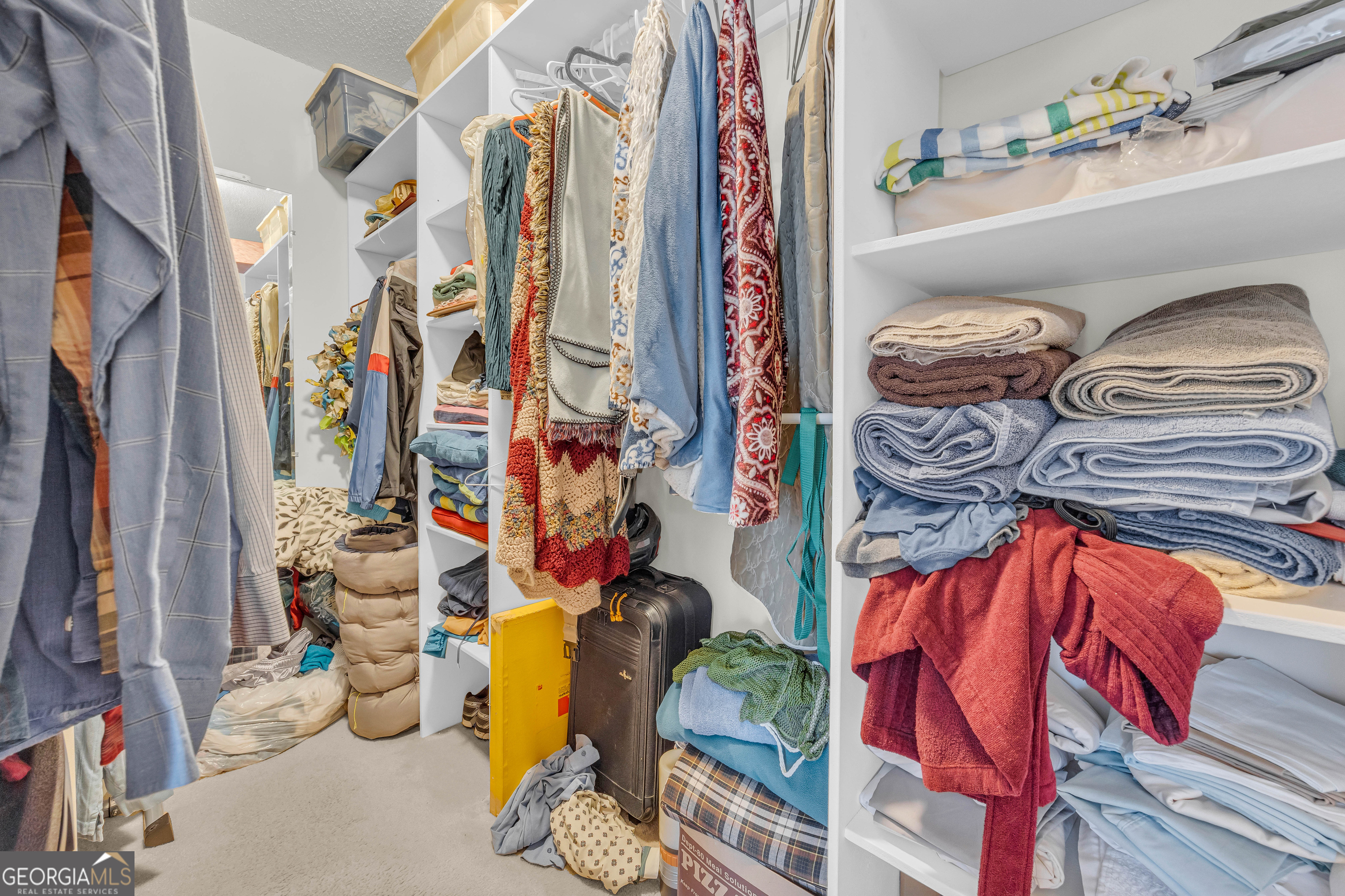 357 Sundew Lane Mount Airy, GA 30563 - Photo 27 of 53 a view of walk in closet with clothes