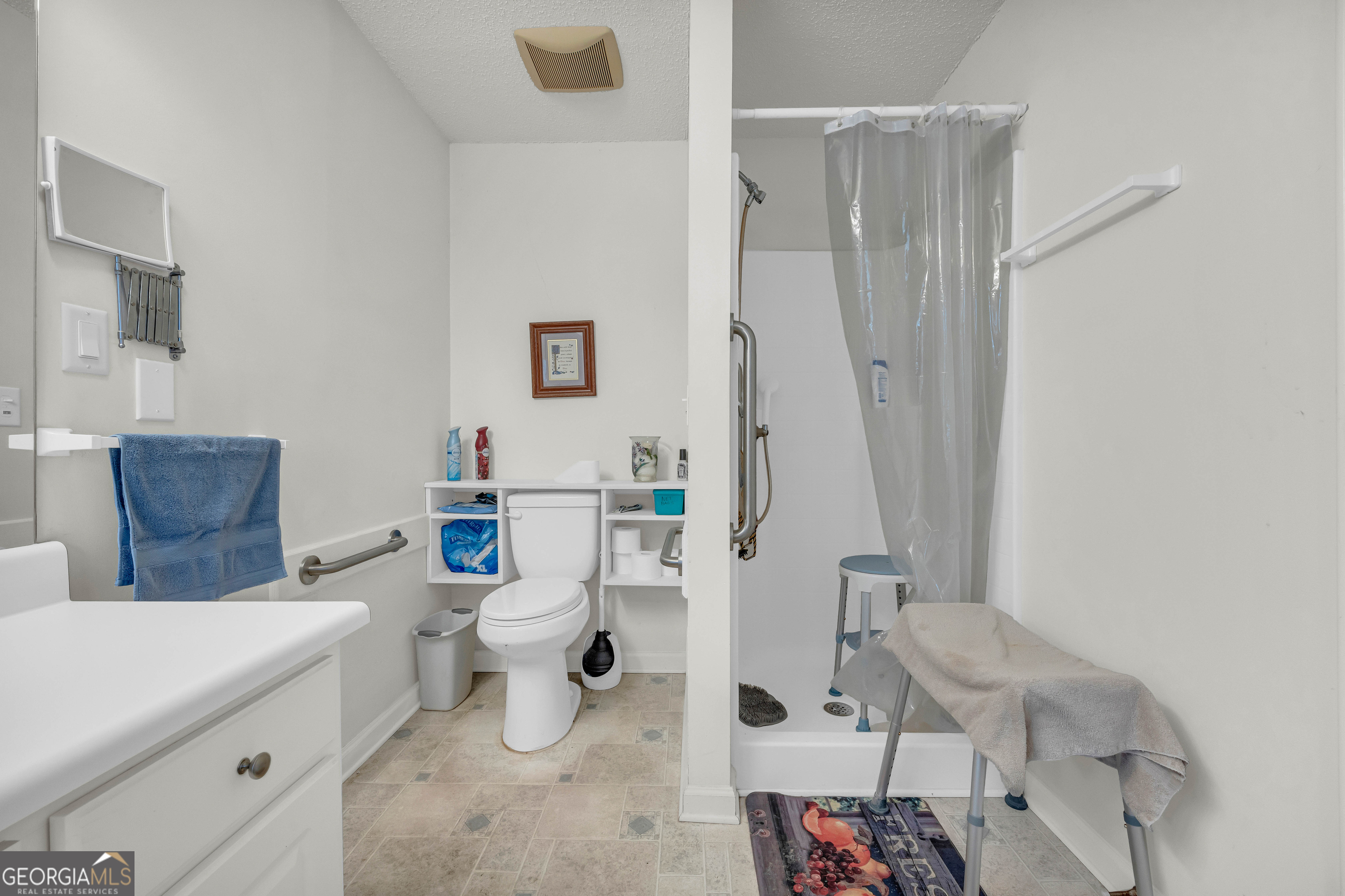 357 Sundew Lane Mount Airy, GA 30563 - Photo 29 of 53 a bathroom with a sink a toilet and a mirror