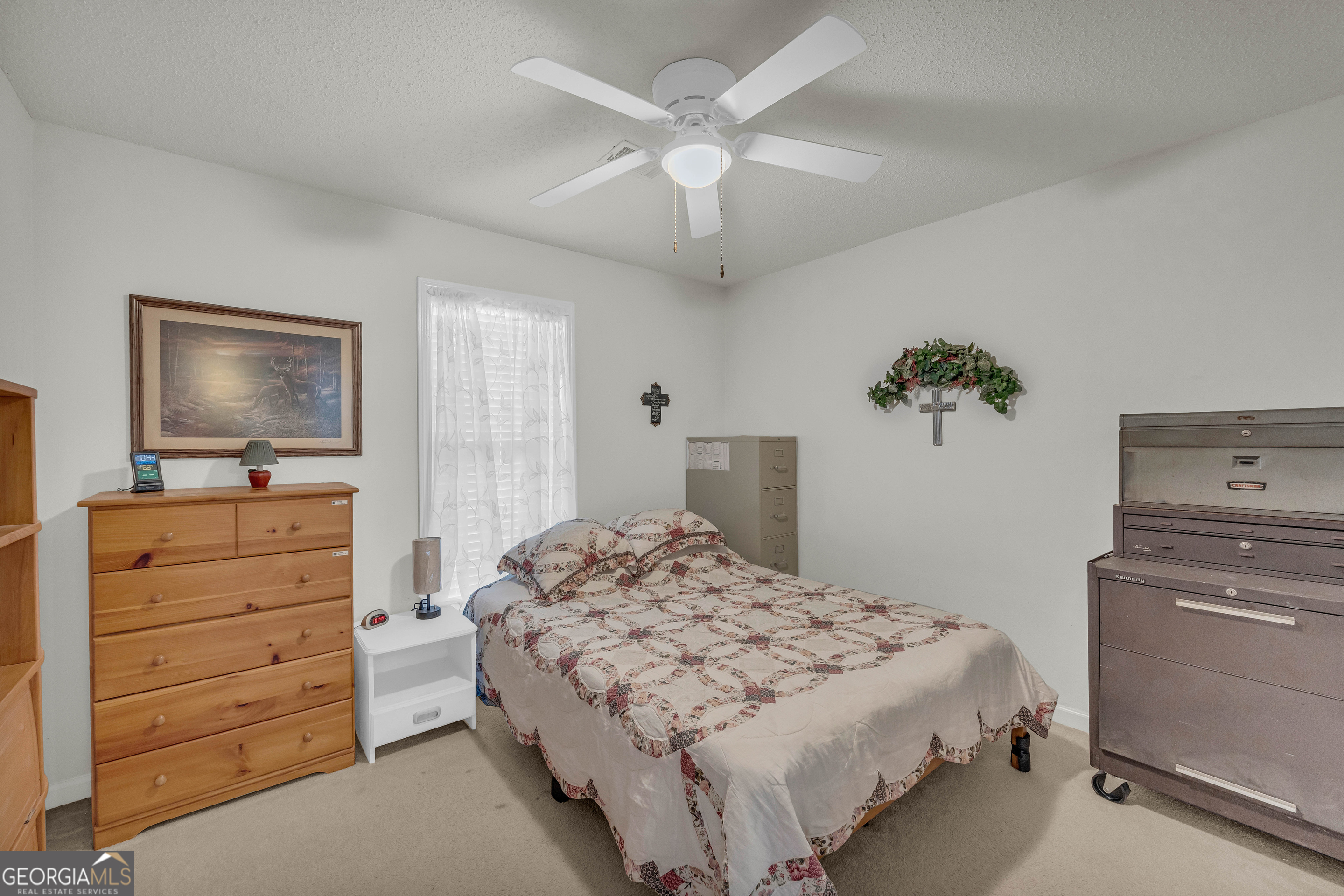 357 Sundew Lane Mount Airy, GA 30563 - Photo 30 of 53 a bedroom with a bed and a dresser