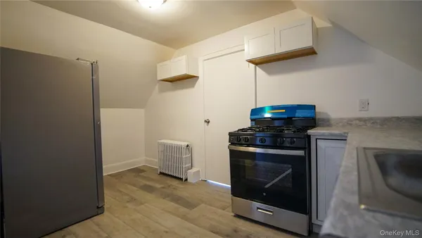 a kitchen with a stove and a microwave