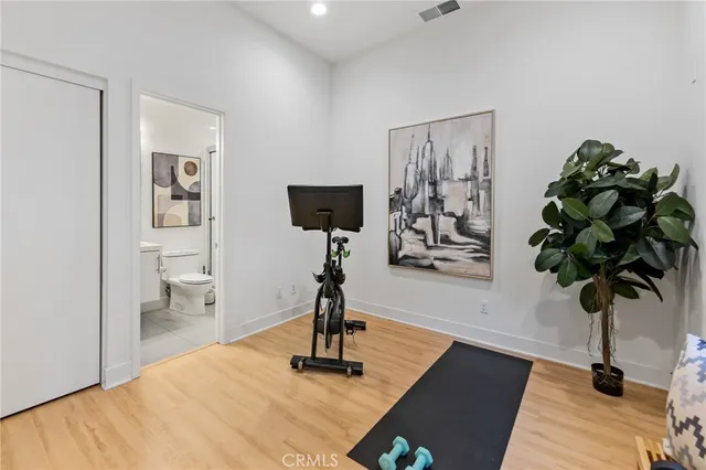 a view of a livingroom with furniture and a potted plant