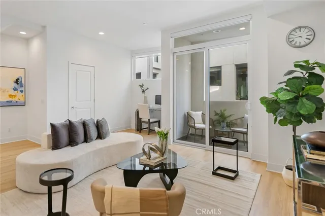 a bedroom with furniture and a potted plant