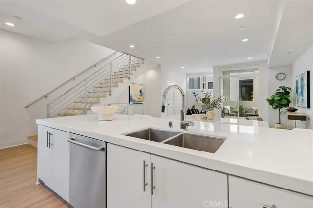 a kitchen with a sink and a refrigerator