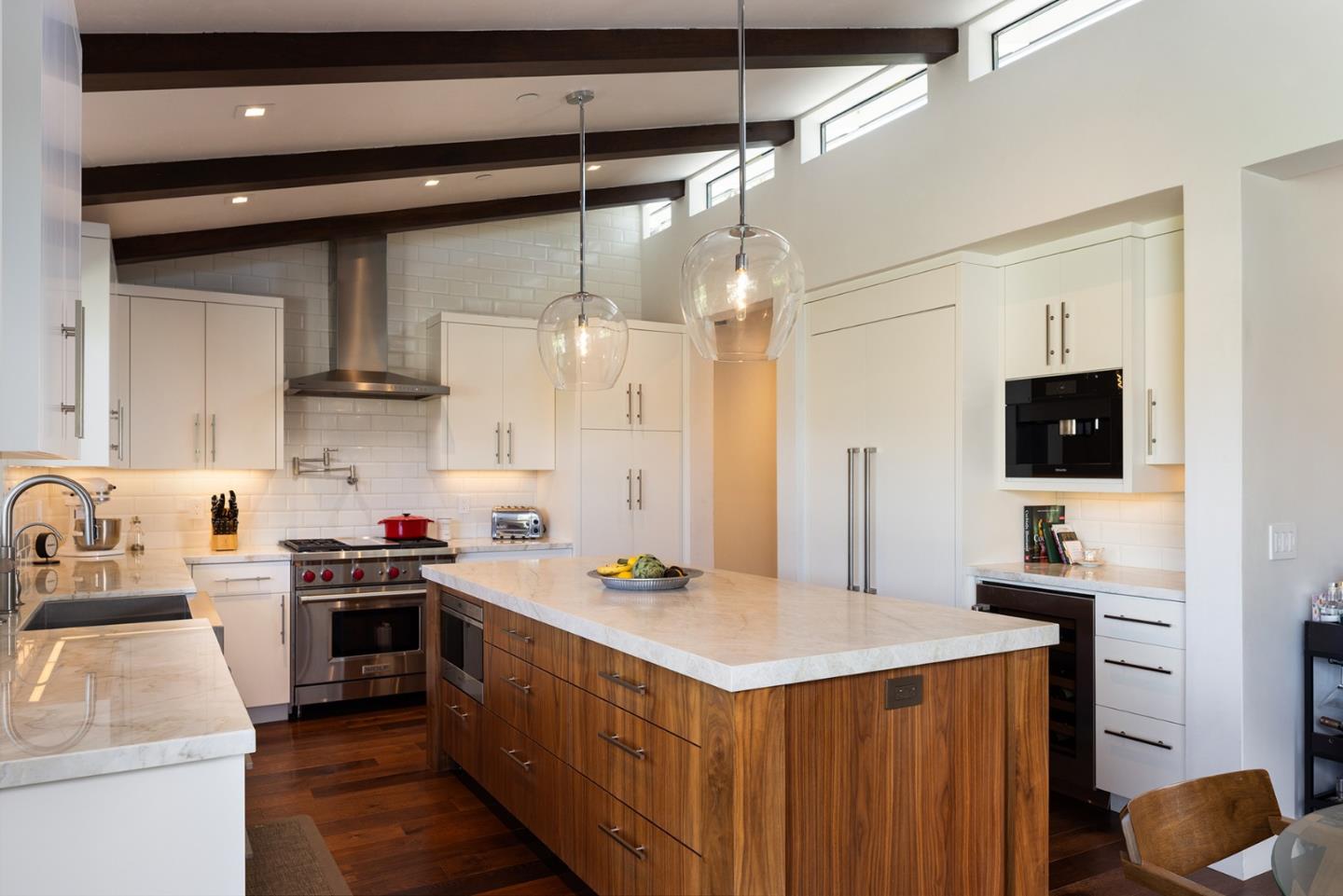 2931 Sloat Road Pebble Beach, CA 93953 - Photo 7 of 34 a kitchen with a sink stove and refrigerator
