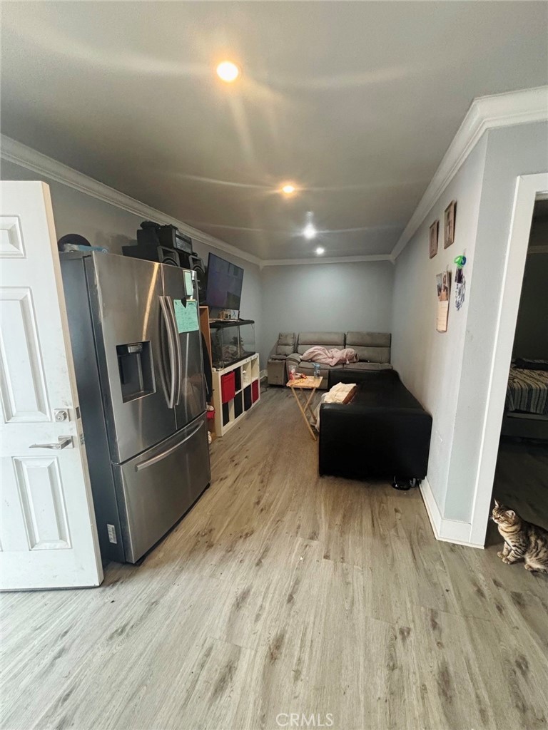 1503 North Chester Avenue Compton, CA 90221 - Photo 16 of 18 a living room with furniture and a flat screen tv