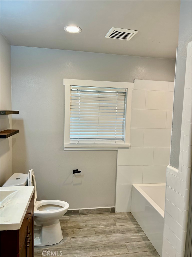 1503 North Chester Avenue Compton, CA 90221 - Photo 6 of 18 a bathroom with a toilet a sink and bathtub