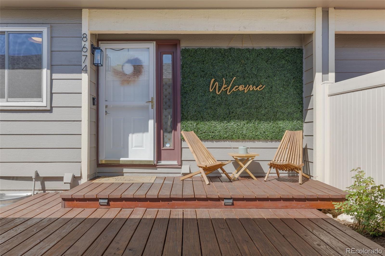 a view of balcony with wooden floor and bench