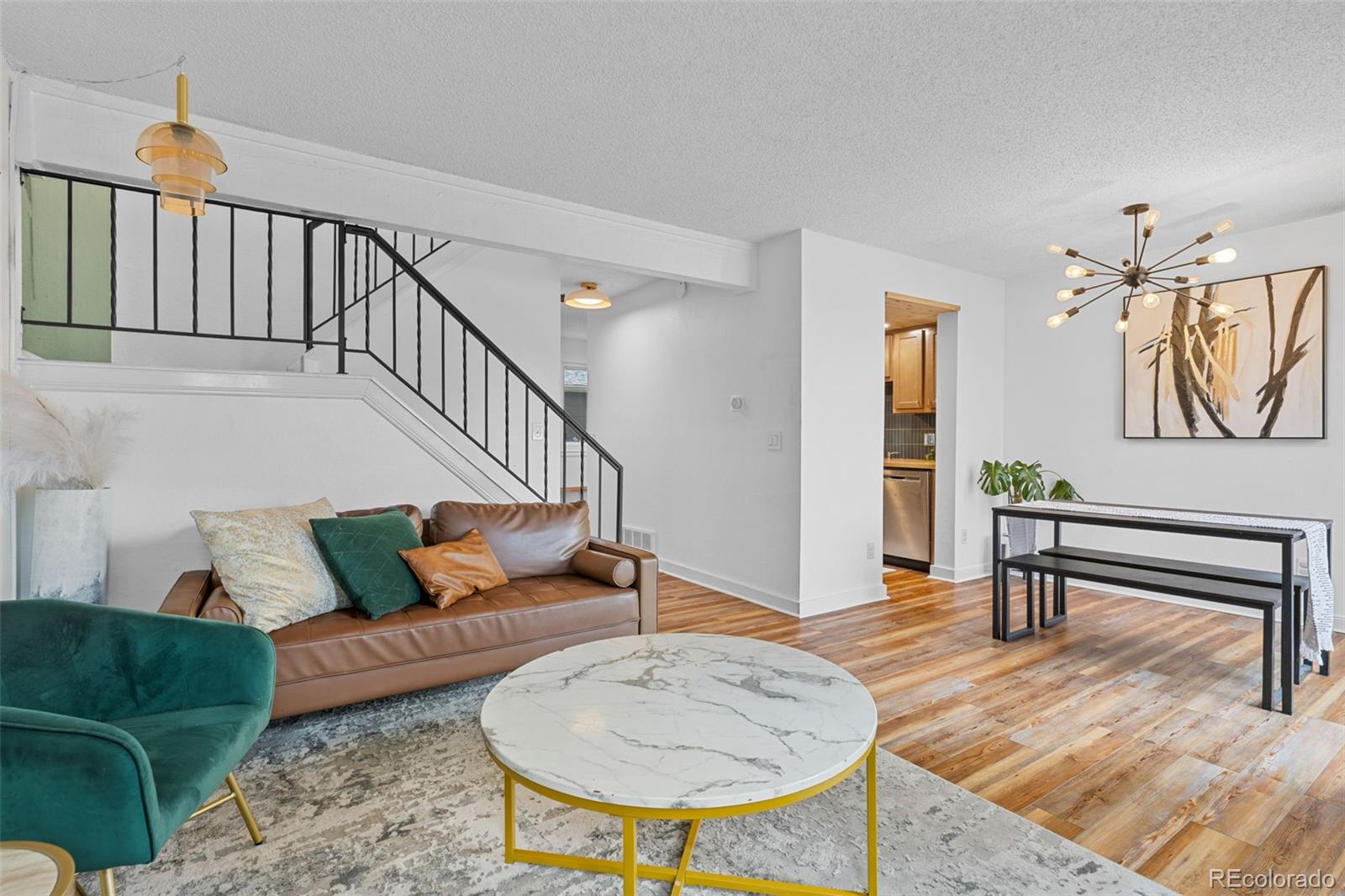 8674 Carr Loop Arvada, CO 80005 - Photo 13 of 43 a living room with furniture and a wooden floor