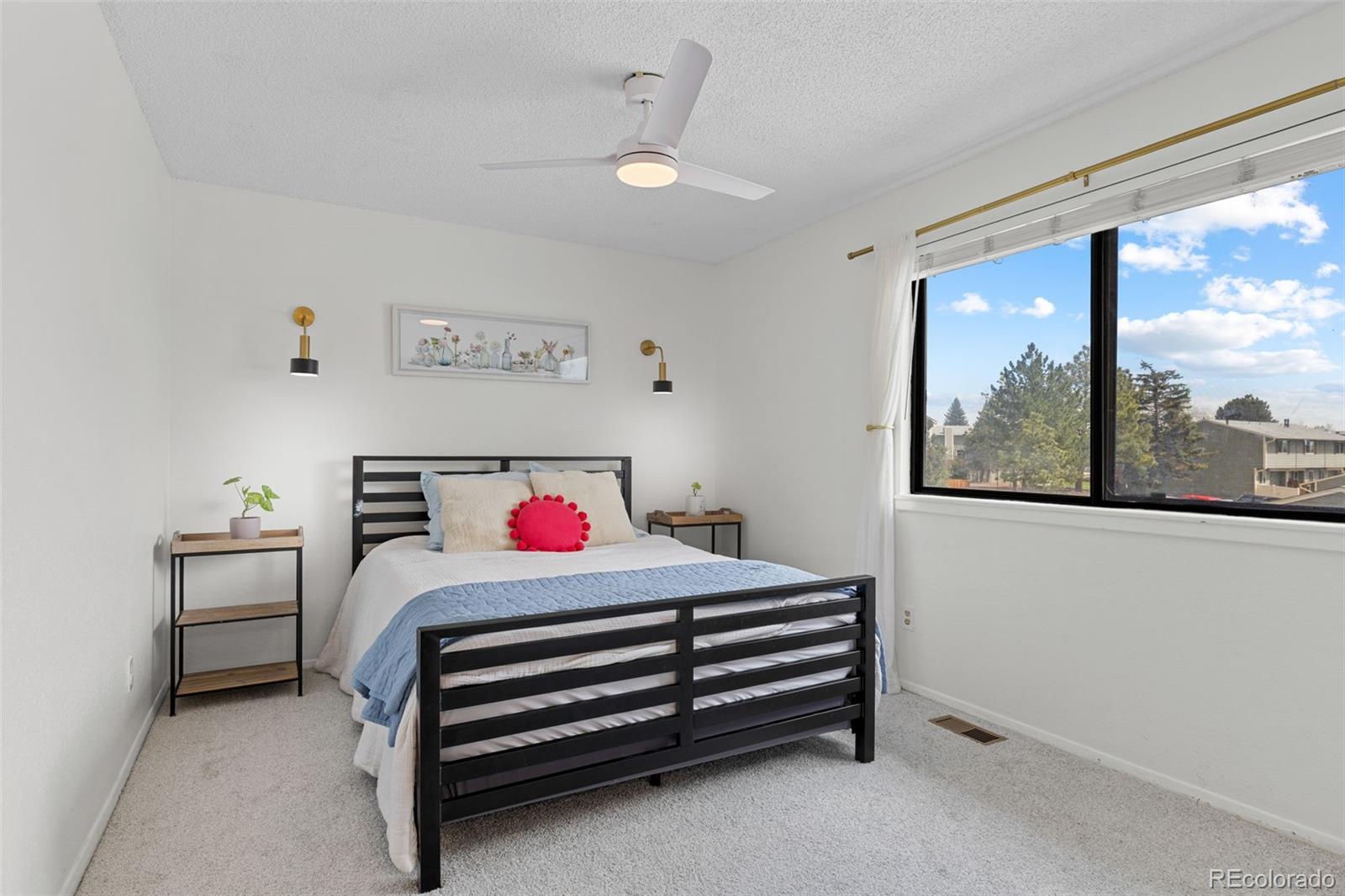 8674 Carr Loop Arvada, CO 80005 - Photo 16 of 43 a room with a bed and a window