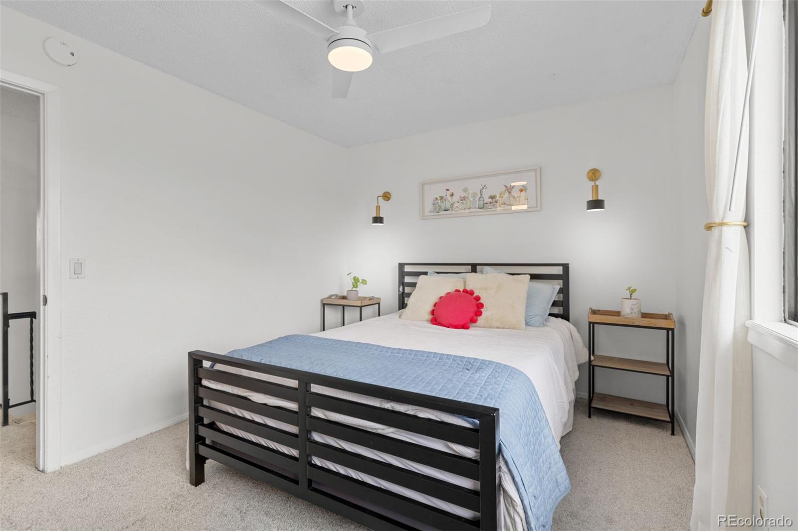 8674 Carr Loop Arvada, CO 80005 - Photo 17 of 43 a bedroom with a bed and a dresser