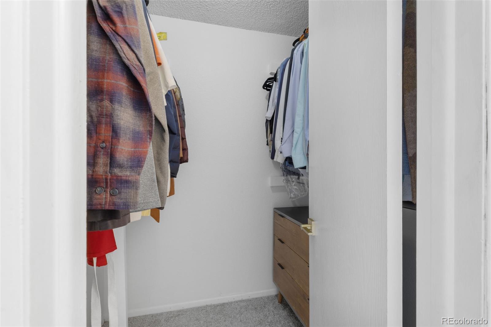 8674 Carr Loop Arvada, CO 80005 - Photo 19 of 43 a view of hallway with stairs