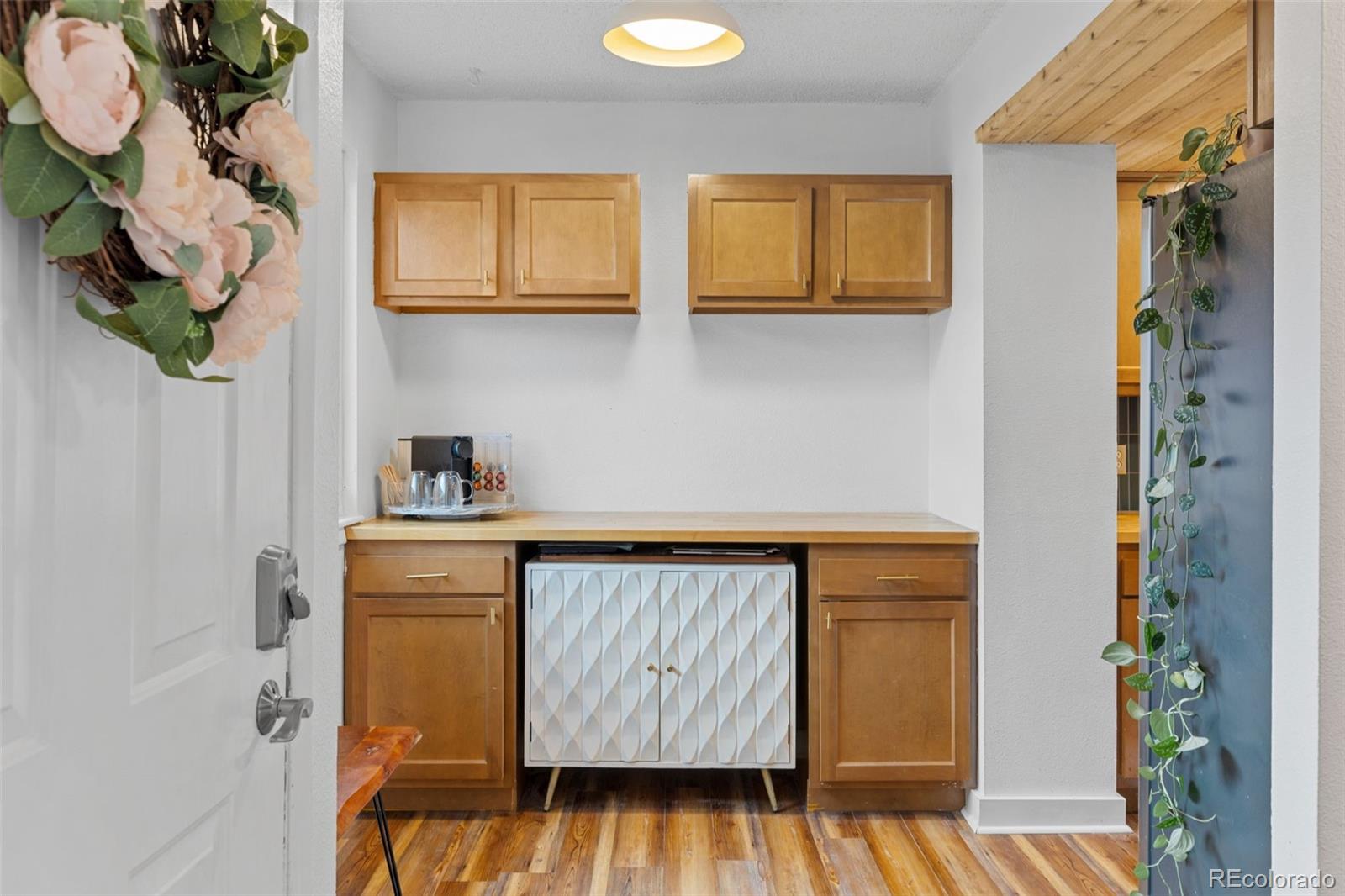 8674 Carr Loop Arvada, CO 80005 - Photo 2 of 43 a kitchen with a sink and cabinets