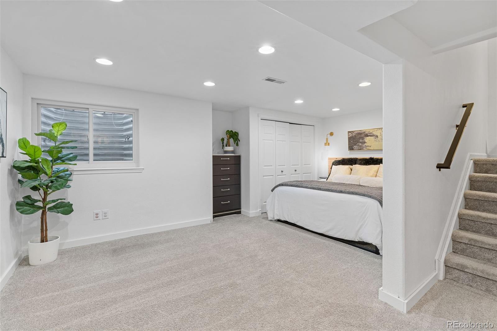 8674 Carr Loop Arvada, CO 80005 - Photo 24 of 43 a living room with furniture and flowers