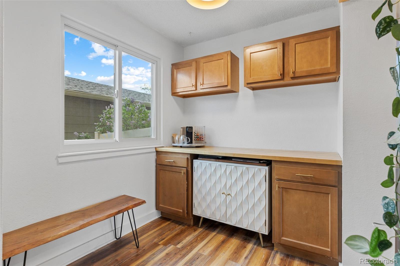 8674 Carr Loop Arvada, CO 80005 - Photo 3 of 43 a utility room with wooden floor washer and dryer