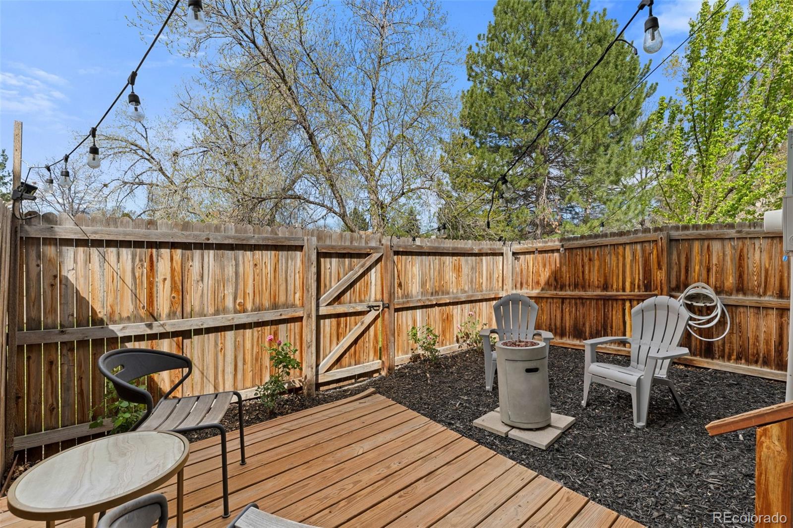 8674 Carr Loop Arvada, CO 80005 - Photo 31 of 43 a view of a chairs in wooden deck
