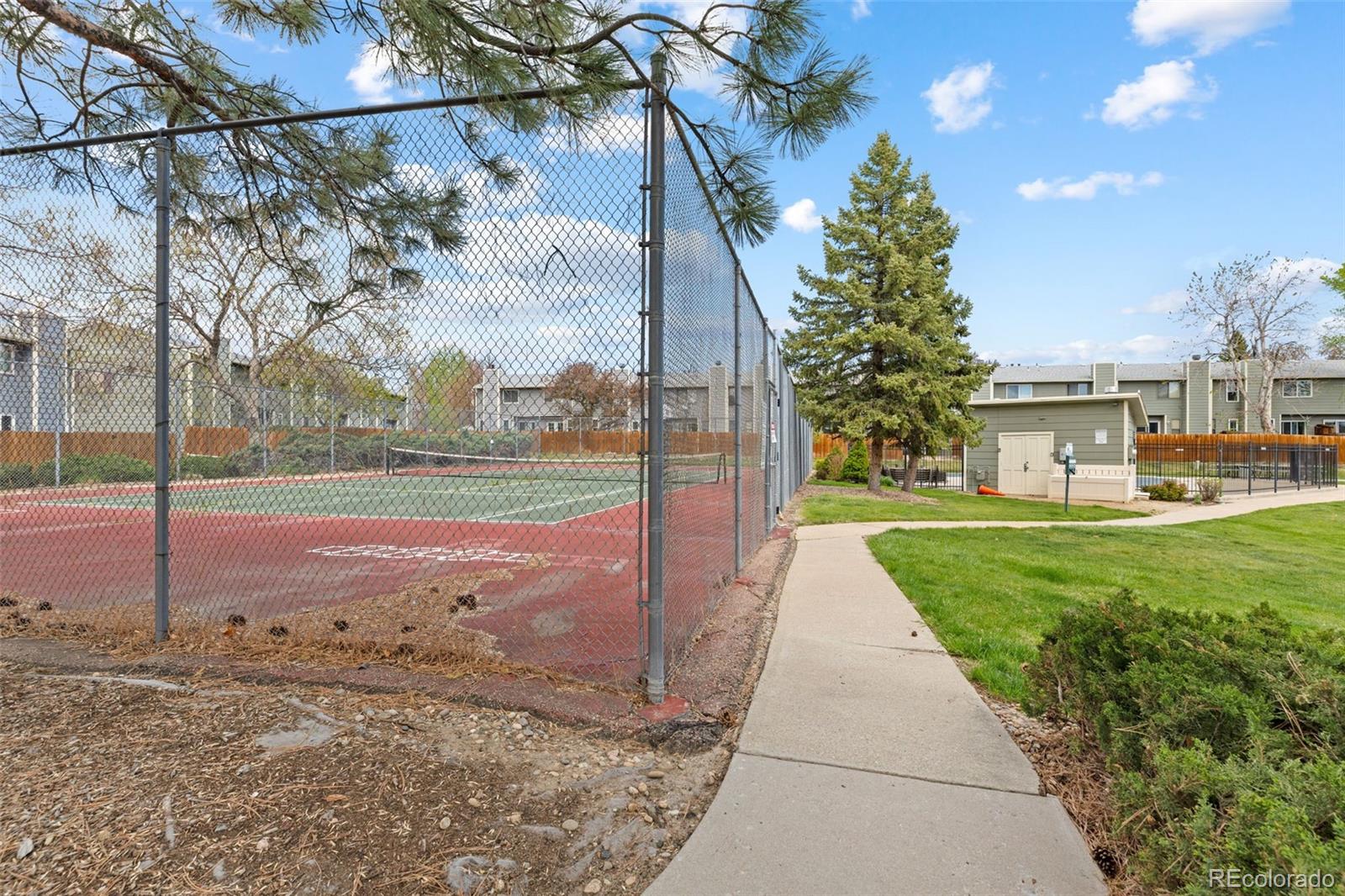 8674 Carr Loop Arvada, CO 80005 - Photo 40 of 43 a view of a street with a building in the background