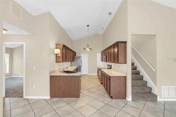 a kitchen with cabinets and furniture