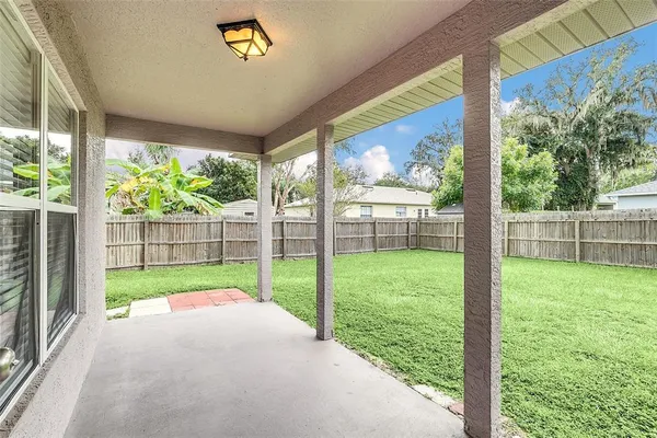 a view of back yard from a room