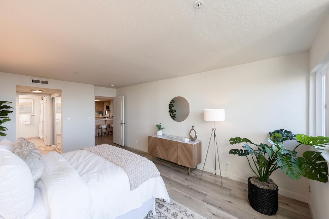 160 Seascape Ridge Drive Aptos, CA 95003 - Photo 18 of 61 a bedroom with bed and a potted plant