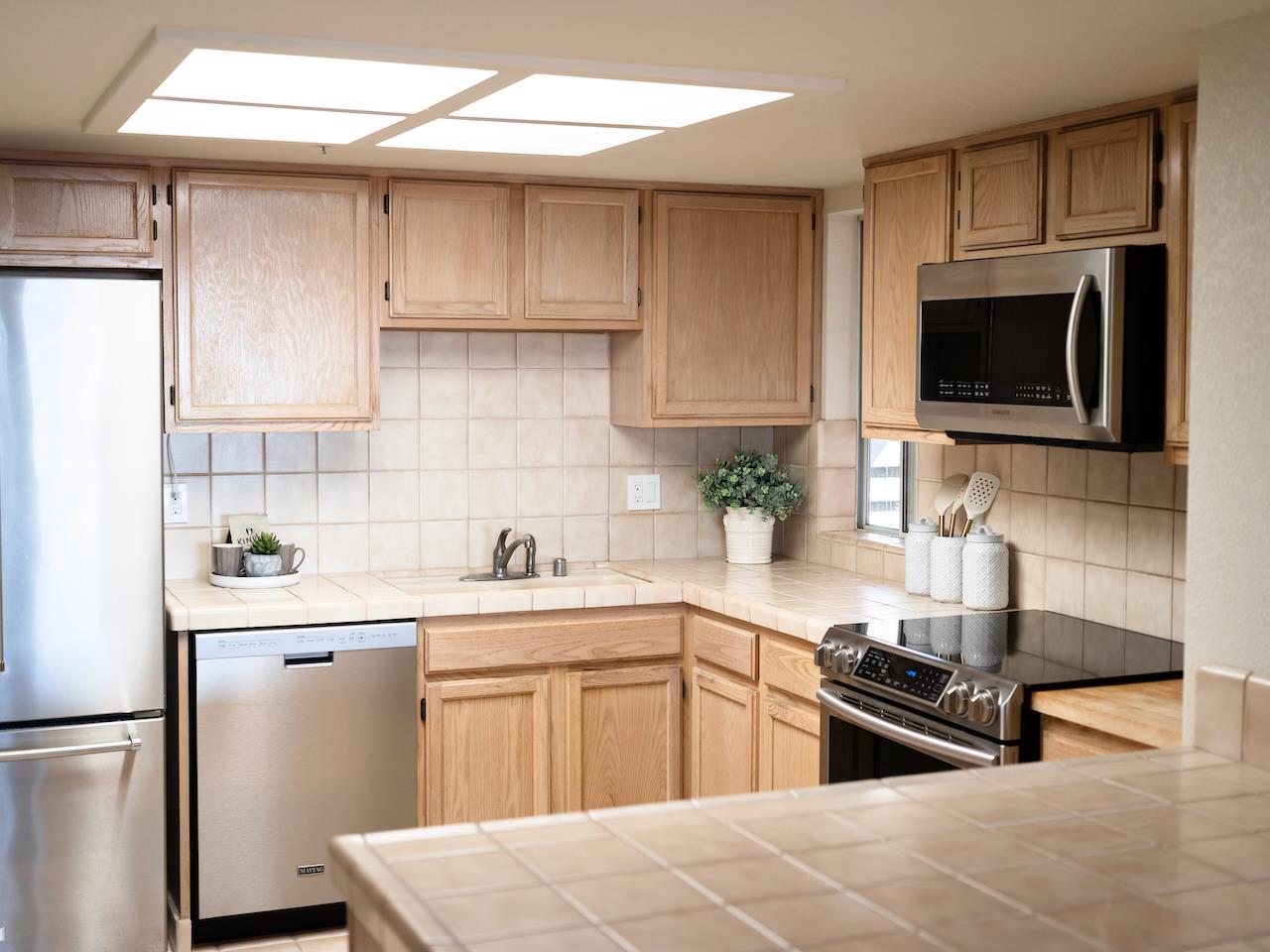 160 Seascape Ridge Drive Aptos, CA 95003 - Photo 24 of 61 a kitchen with a sink stove and microwave