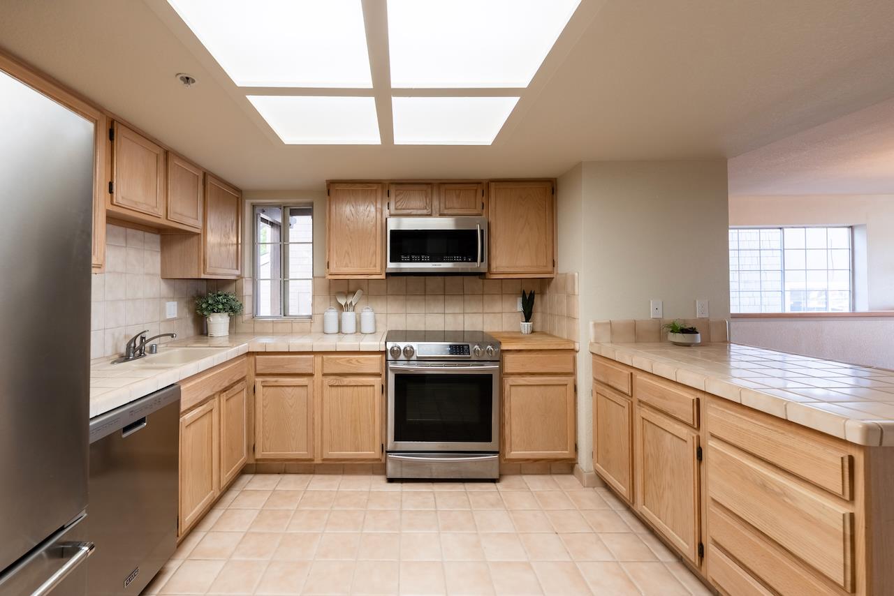 160 Seascape Ridge Drive Aptos, CA 95003 - Photo 29 of 61 a kitchen with stainless steel appliances granite countertop a stove top oven a sink dishwasher and a refrigerator