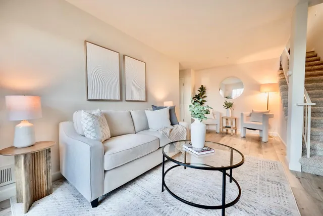 a bathroom with a granite countertop sink toilet and a mirror