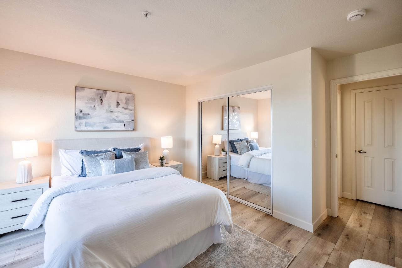 160 Seascape Ridge Drive Aptos, CA 95003 - Photo 46 of 61 a bedroom with a large bed and a chandelier