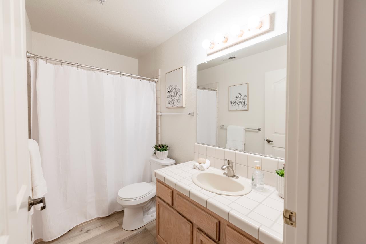 160 Seascape Ridge Drive Aptos, CA 95003 - Photo 49 of 61 a bathroom with a granite countertop sink toilet and a mirror