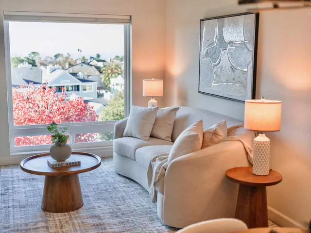 a living room with furniture and a painting