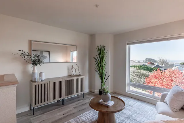 a view of a dining room with furniture window and outside view