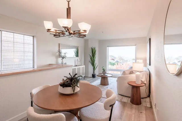 a view of a dining room with furniture window and wooden floor