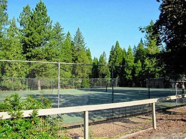311 Fairway Drive Murphys, CA 95247 - Photo 14 of 15 a view of a yard with wooden fence